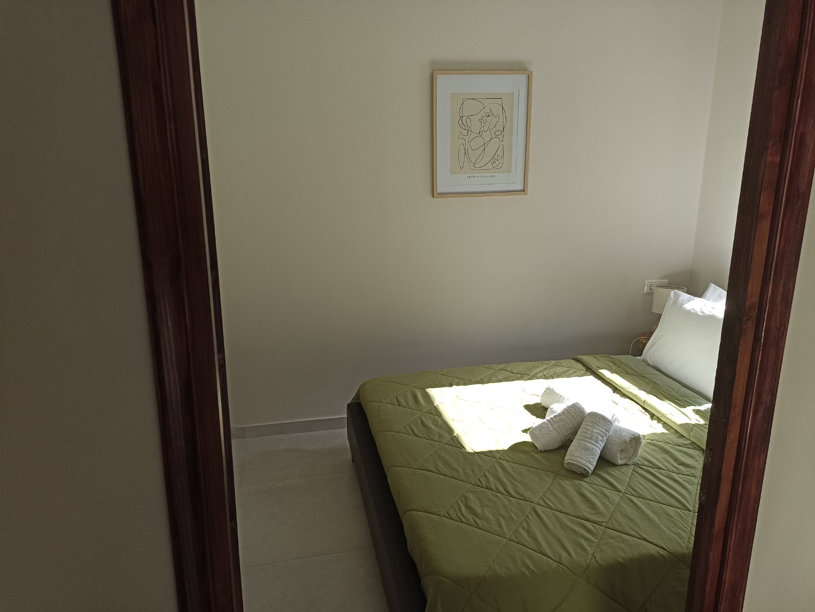 Comfortable bedroom with green bedding