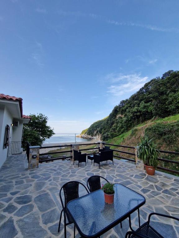 Terrace dining area with coastal view